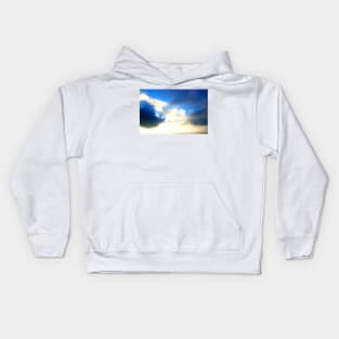 Blue sky covered with dark and light clouds Kids Hoodie